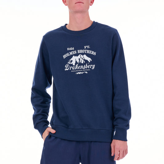 Person wearing a navy blue sweatshirt with white text and mountain graphic on a white background