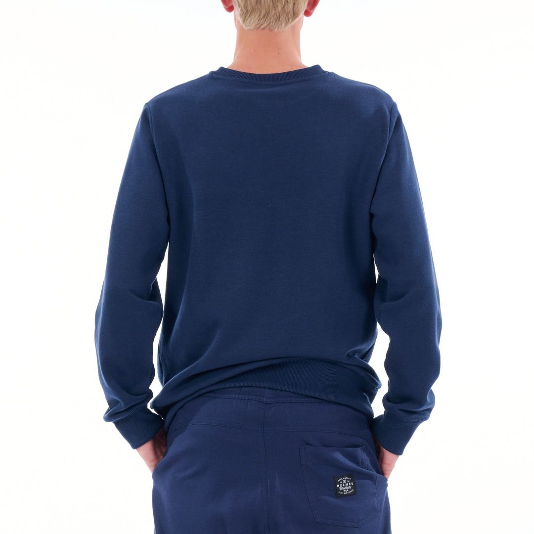 Person wearing a navy blue long-sleeve shirt and pants on a white background