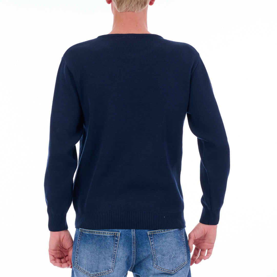 Person wearing a navy blue sweater and blue jeans on a white background