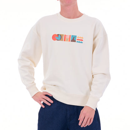 Person wearing a cream sweater with colorful graphic design on a white background