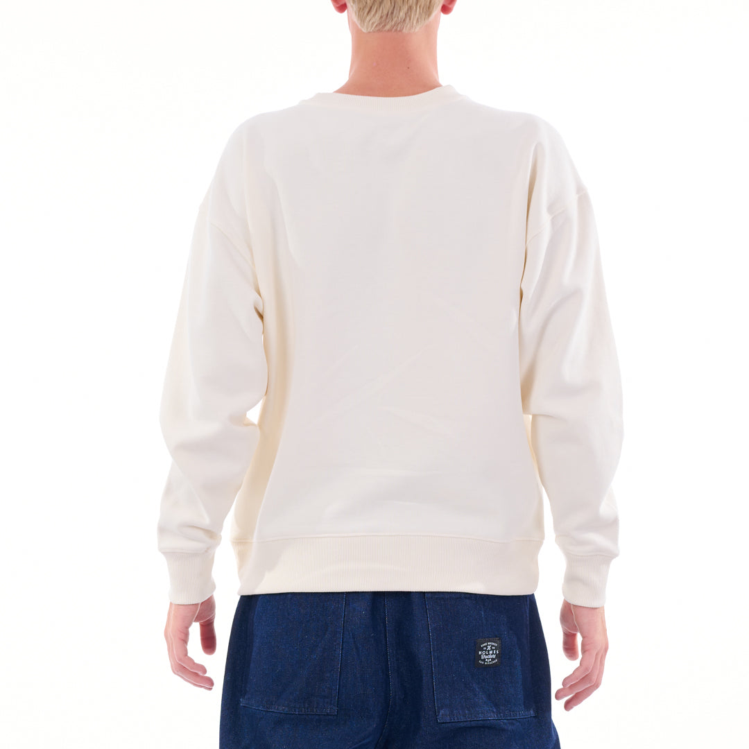 Person wearing a white sweatshirt and blue pants on a white background