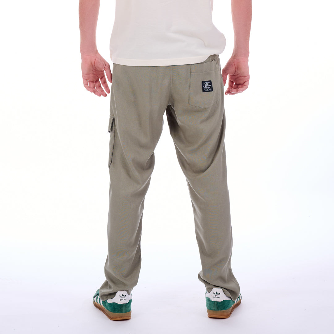 Beige cargo pants worn by a person on a white background
