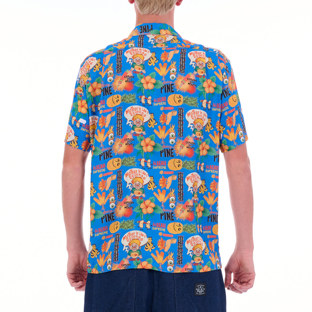 Person wearing a colorful patterned shirt on a white background