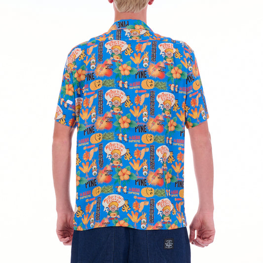 Person wearing a colorful patterned shirt on a white background