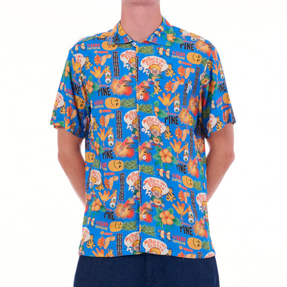Person wearing a colorful patterned shirt on a white background