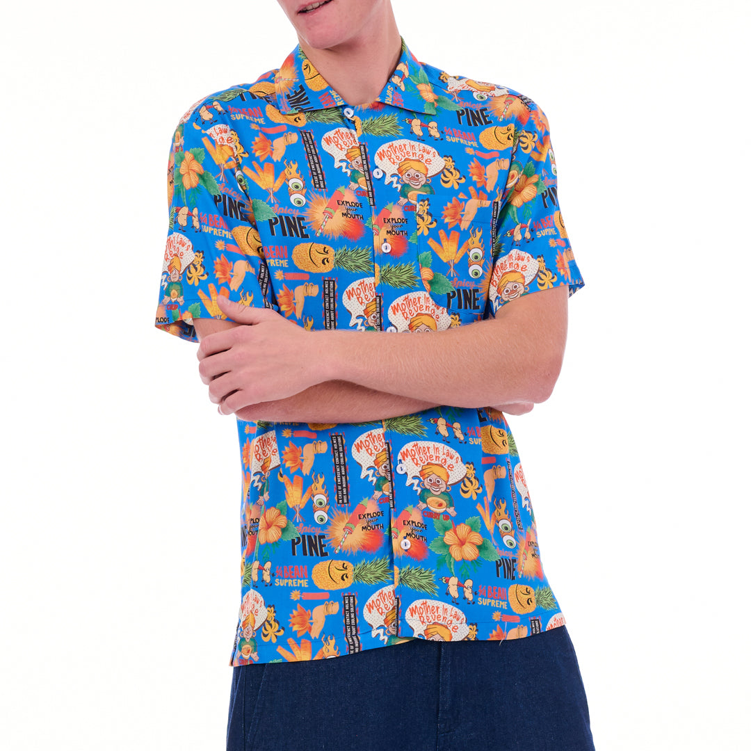 Person wearing a colorful patterned shirt on a white background