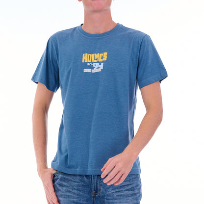 Person wearing a blue t-shirt with 'Holmes' logo on a white background