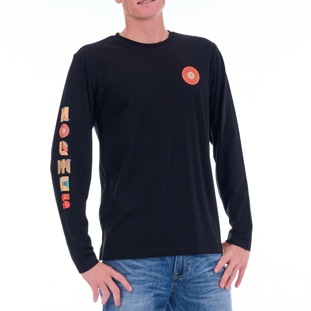 Person wearing a black long-sleeve shirt with colorful designs on sleeves and chest against a white background