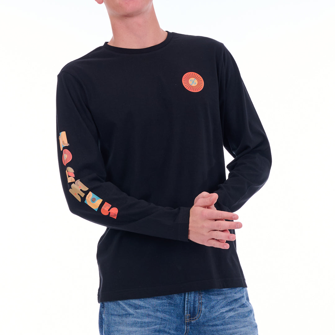 Black long-sleeve shirt with colorful designs on sleeves and chest, worn by a person.