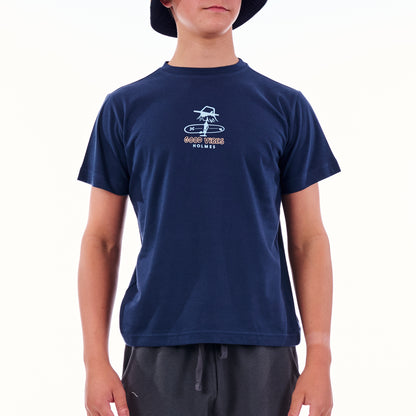 Person wearing a navy blue t-shirt with a logo on a white background