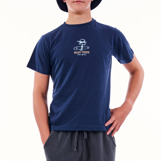 Person wearing a navy blue t-shirt with a logo on a white background