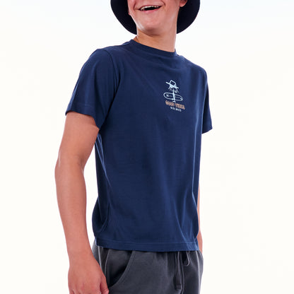 Child wearing a navy blue t-shirt with a logo on a white background