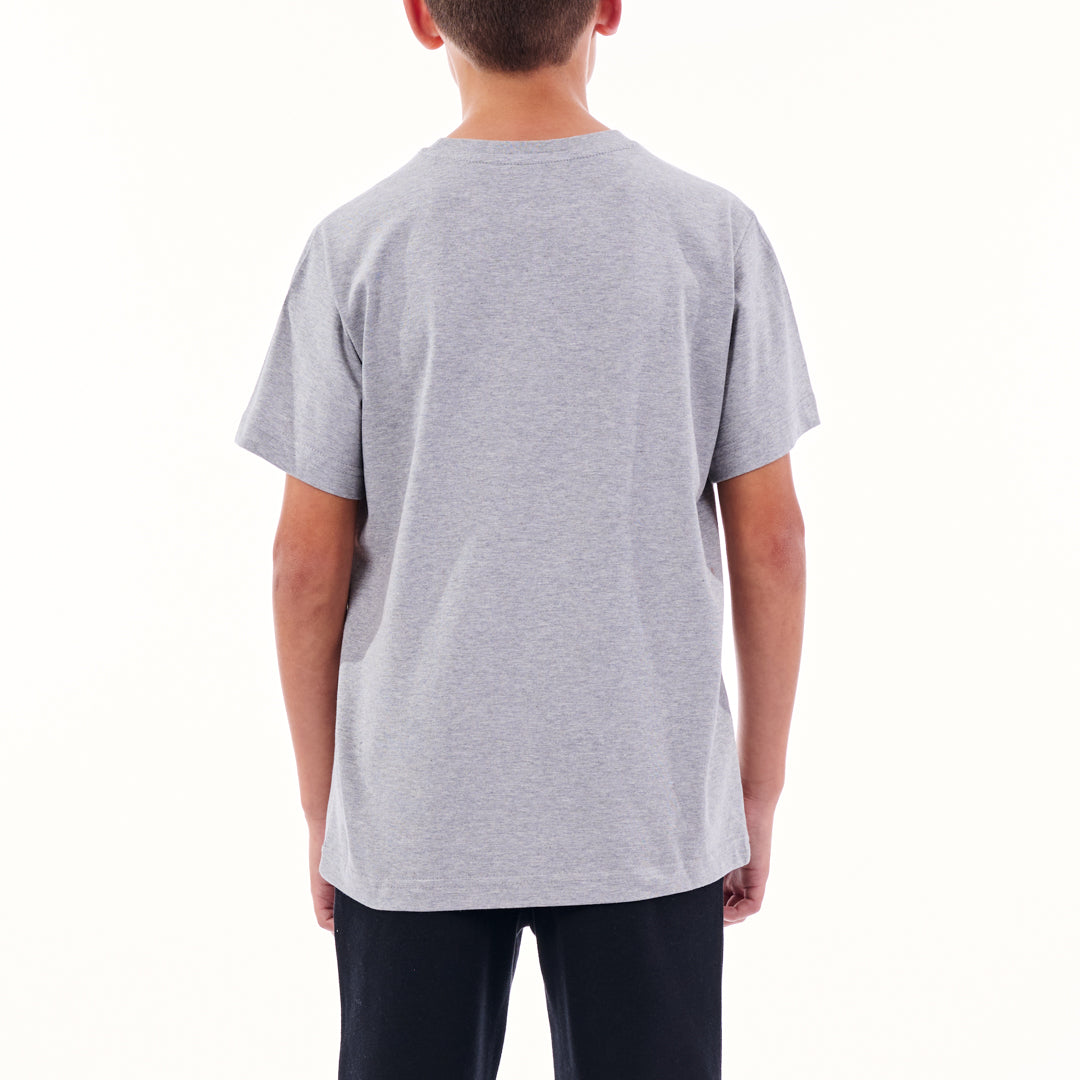 Person wearing a plain gray t-shirt on a white background