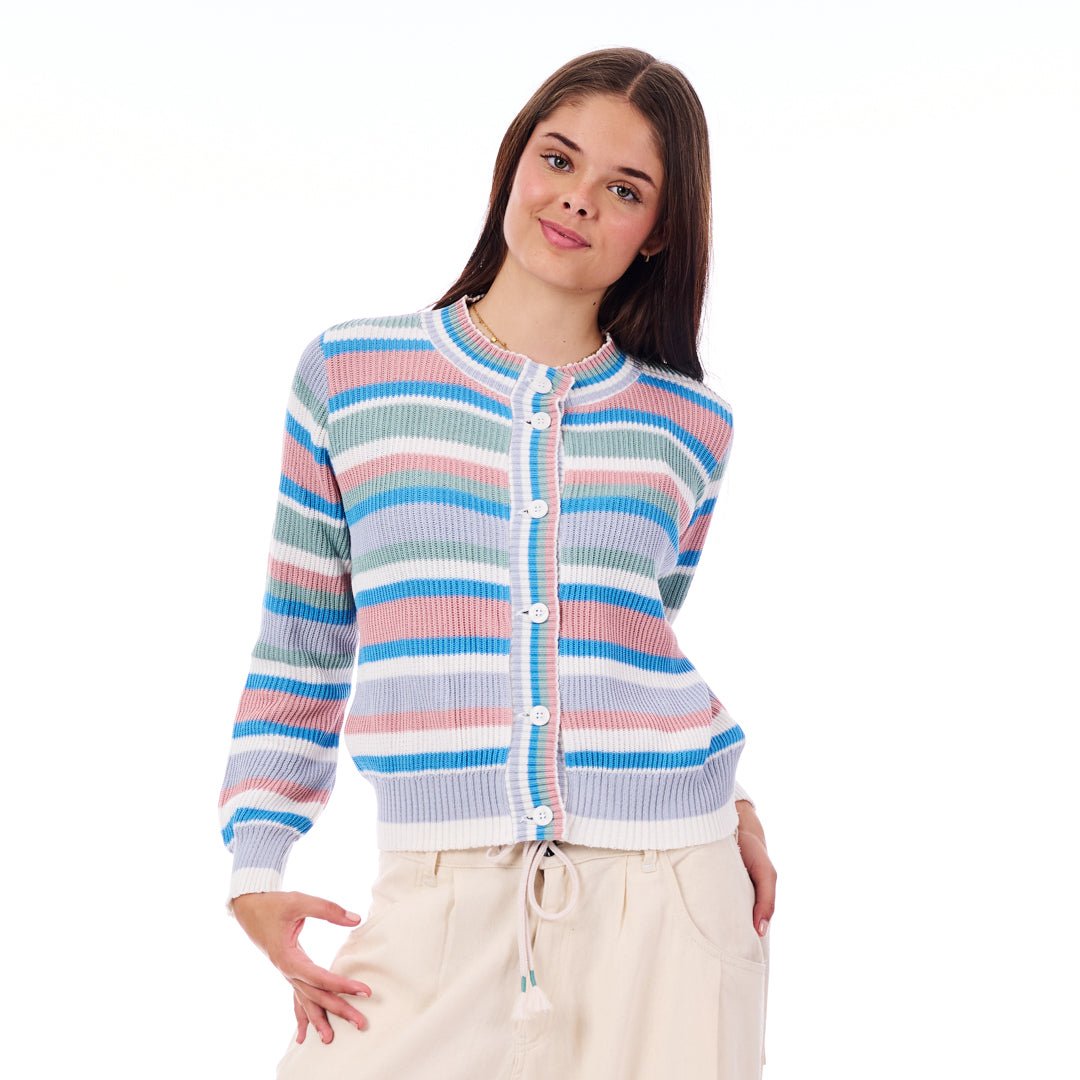 Woman wearing a colorful striped sweater on a white background