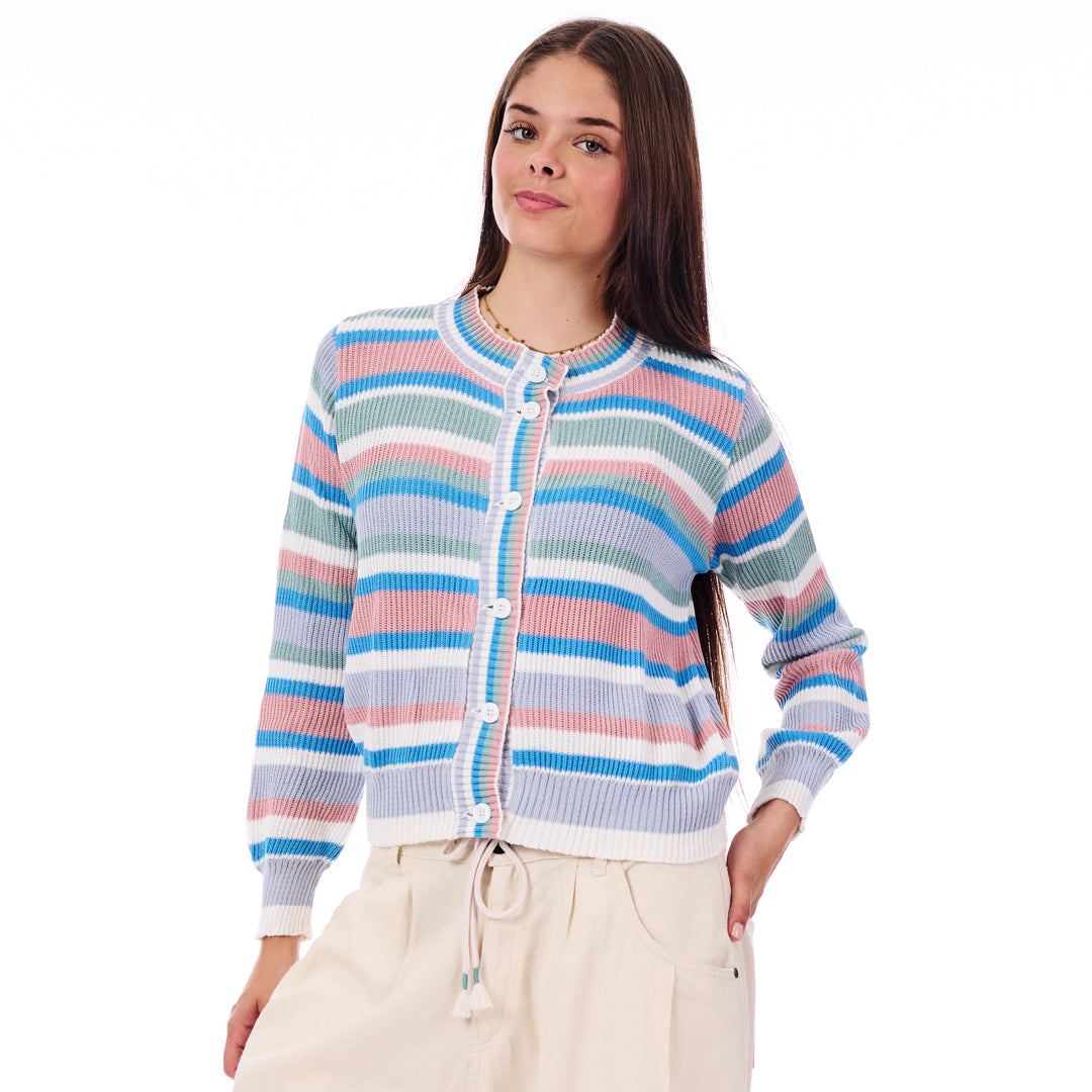 Woman wearing a colorful striped sweater on a white background