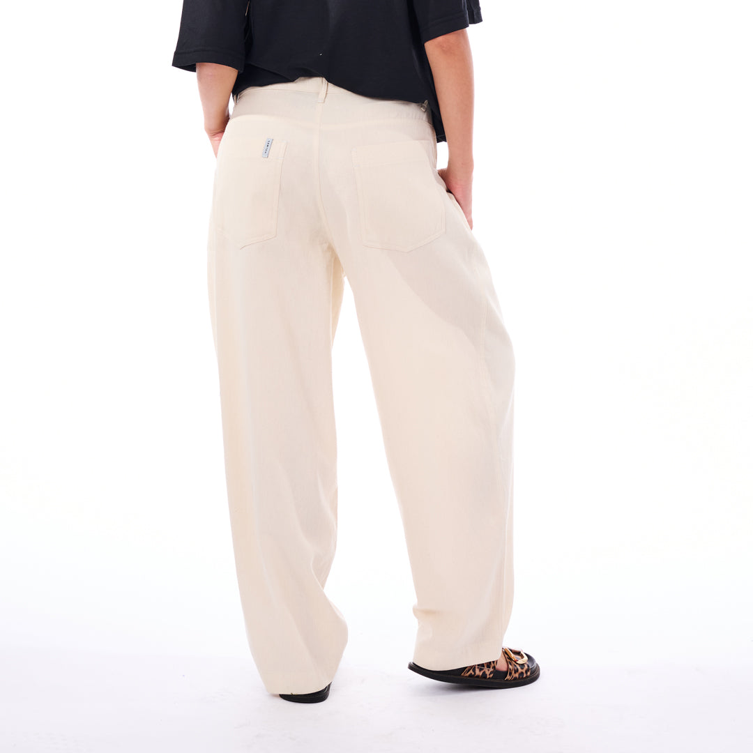 Person wearing beige pants on a white background