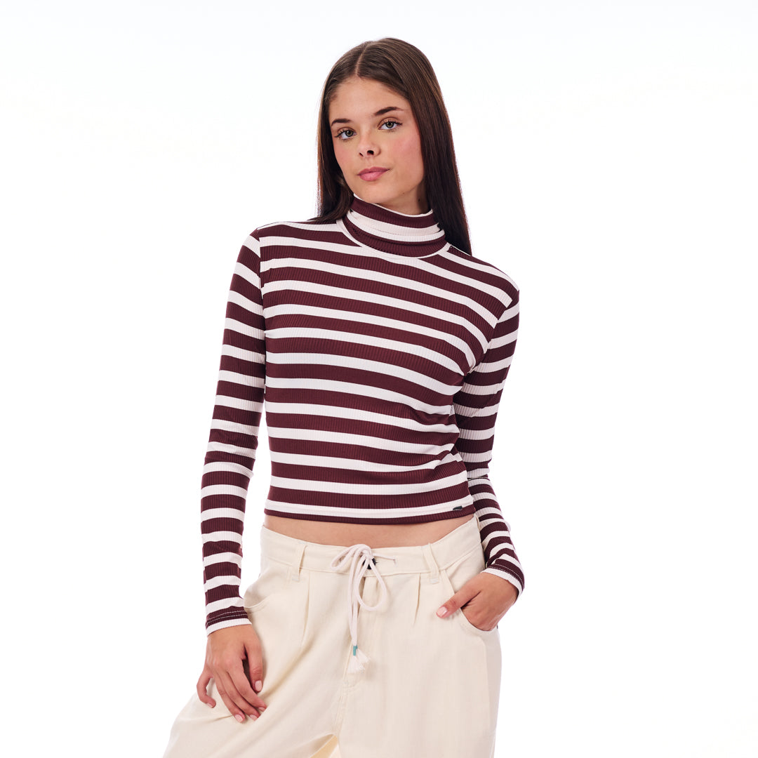 Woman wearing a striped long-sleeve top on a white background