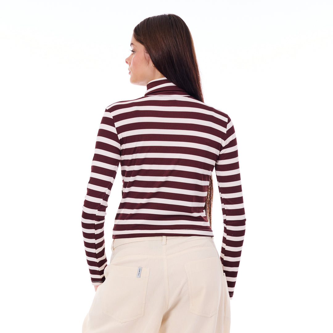 Woman wearing a maroon and white striped long-sleeve shirt on a white background