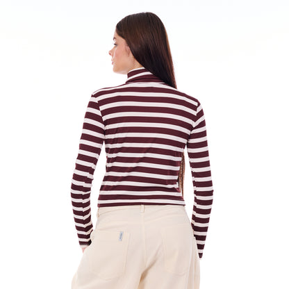 Woman wearing a maroon and white striped long-sleeve shirt on a white background